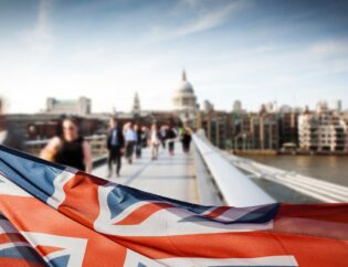 UK Union Flag over Millennium Bridge Milton Keynes, London, Tax, Accounting, Business set-up, Tax refund, EXPAT, Immigration, work visa, and financial consulting.